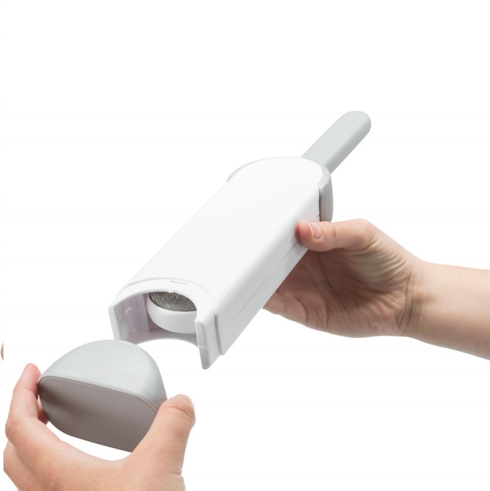 Hårfjerningsbørste med rengjøringsholder